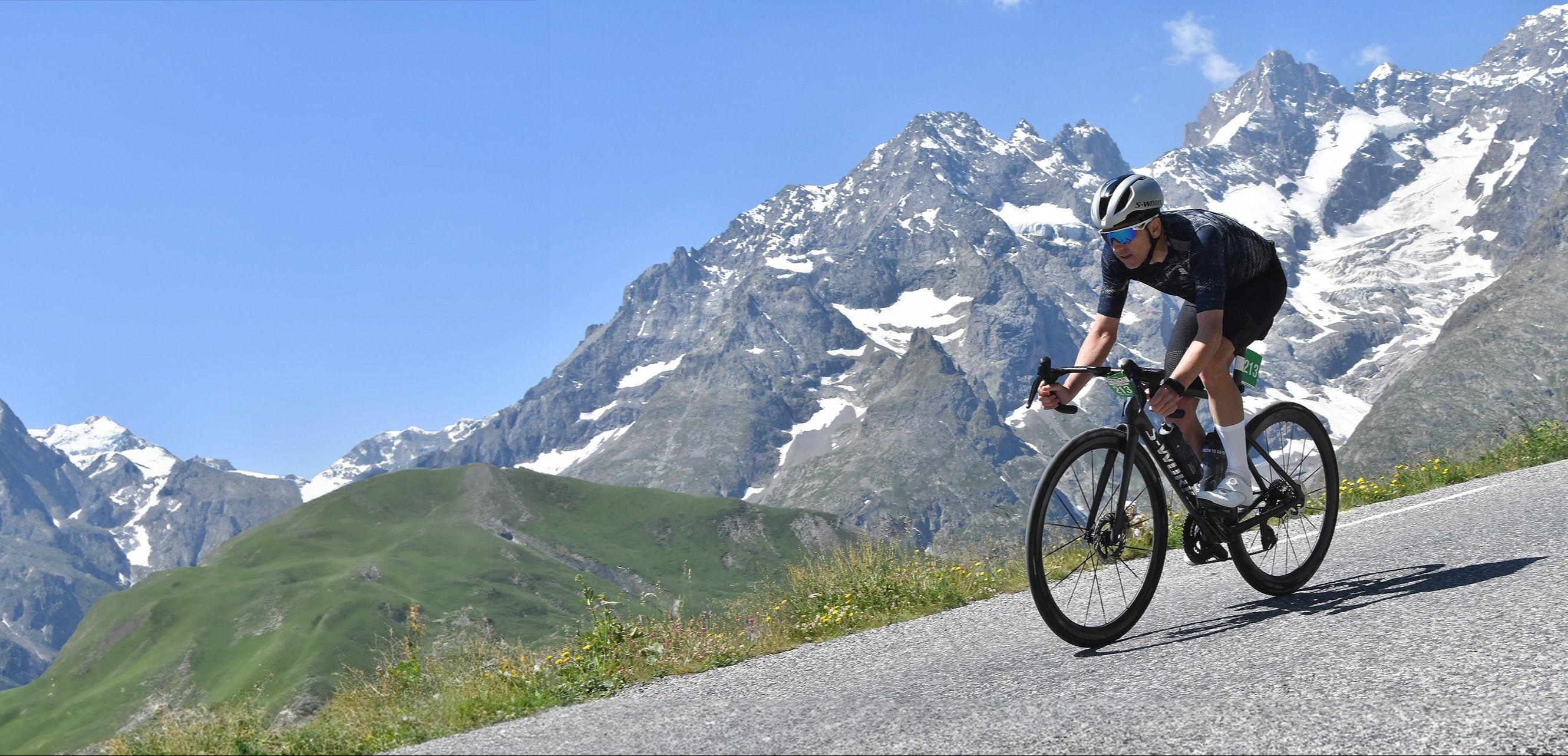 Steve James riding in white cycling socks during the Marmotte 2025